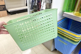 hand holding a laundry basket 