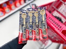 hand holding colgate harry potter electric toothbrushes at target