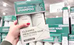 hand holding amos professional hair care set