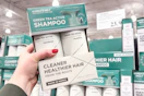 hand holding amos professional hair care set