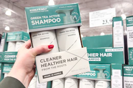 hand holding amos professional hair care set