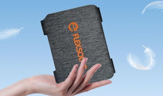 a hand holding a portable solar panel