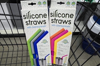 2 packs of silicone straws in a cart
