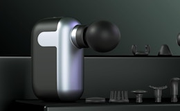 a mini massage gun with it's attachments