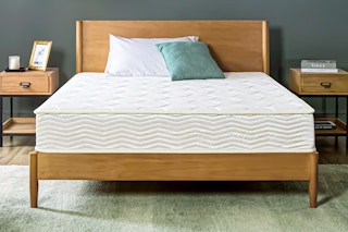 Lifestyle image of the Zinus 8" Basic Bonnell Innerspring Mattress on bed in bedroom setting