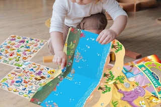a child playing with ocean themed stickers