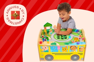 Child playing with the activity table
