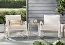 white patio rockers and table