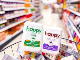 2 happy coffee canisters sitting on top of groceries in a target aisle