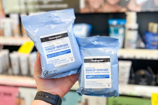 hand holding two packs of neutrogena makeup wipes