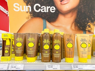 Bottles of Sun Bum sunscreen stocked on a shelf at Target.