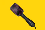 hair dryer brush on a yellow background