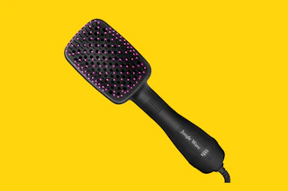 hair dryer brush on a yellow background