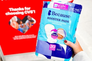 person holding a package of because booster pads