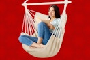 Woman siting in large beige hammock chair swing