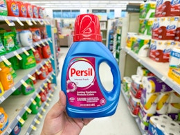 hand holding persil detergent in walgreens