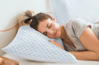 a woman using cooling pillows