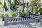 lifestyle image of a porch bed swing