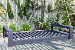 lifestyle image of a porch bed swing