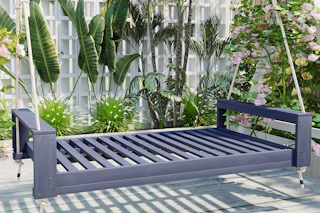 lifestyle image of a porch bed swing