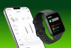 smart watch next to phone screen with fitness stats