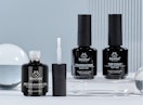 bottle of gel nail builder and top coats on a display 