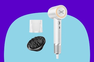 A white ionic hair dryer with a compact head, a white nozzle and a black diffuser