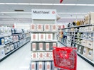 target cart parked in front of sheet sets sitting on a shelf