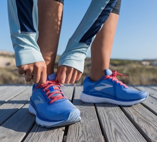 someone tying their shoes