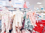 carter's sleep & plays sitting on target shelves