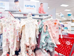 carter's sleep & plays sitting on target shelves