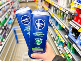 2 Nivea Body Wash bottles held up in stores center aisle