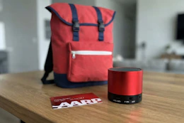 aarp membership card and two free gifts on a table