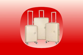 Three HIKOLAYAE suitcases in the color Champagne over red color fade single product background