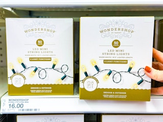 hand holding a box of wondershop string lights on target shelf