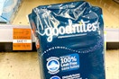 package of huggies goodnites by a clearance sign