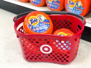 Target store shopping basket with bottles of Tide Pods in it