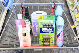 degree dry spray deodorant, gillette and venus disposable razors, sally hansen hard as nails, loreal toner, and herbal essences in a cart