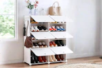 Lifestyle image of a white shoe rack in home setting