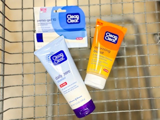 hand holding clean & Clear face washes