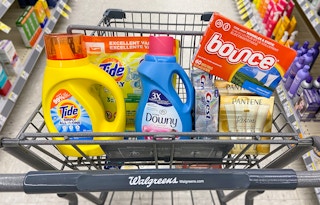 a walgreens cart with pantene, crest, tide, downy, and bounce
