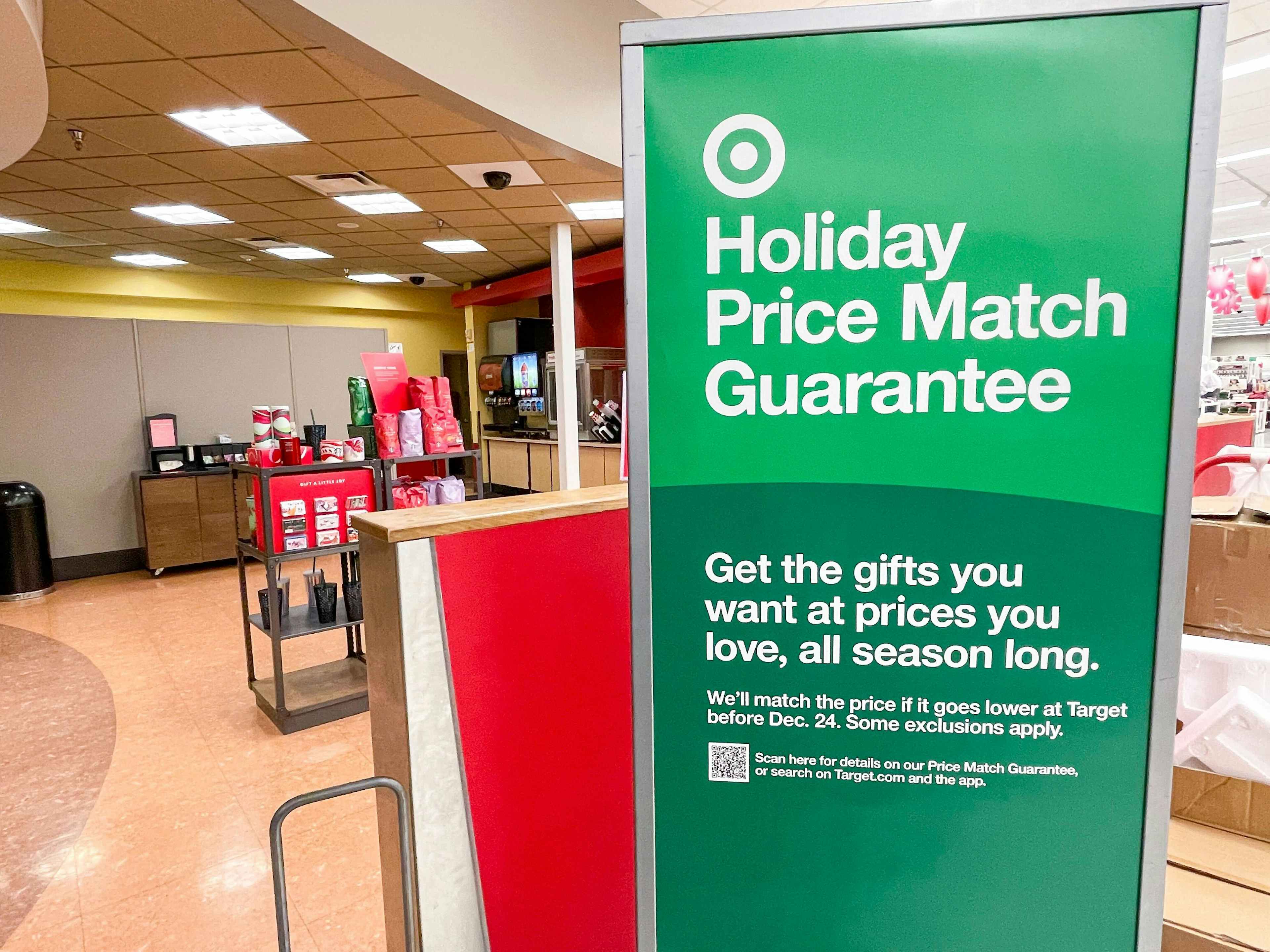 A holiday price match guarantee sign inside Target.