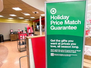 A holiday price match guarantee sign inside Target.