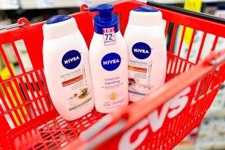 two Nivea body washes and one lotion inside CVS shopping basket