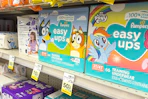 pampers easy ups diaper boxes with 50% off clearance signs