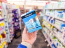 person holding neutrogena hydro boost moisturizer in an aisle