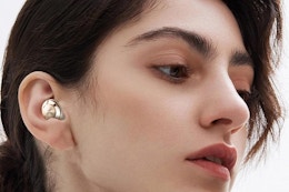 a woman wearing ear plugs