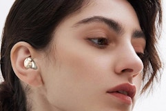 a woman wearing ear plugs