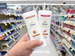 hand holding dove deodorants in walgreens