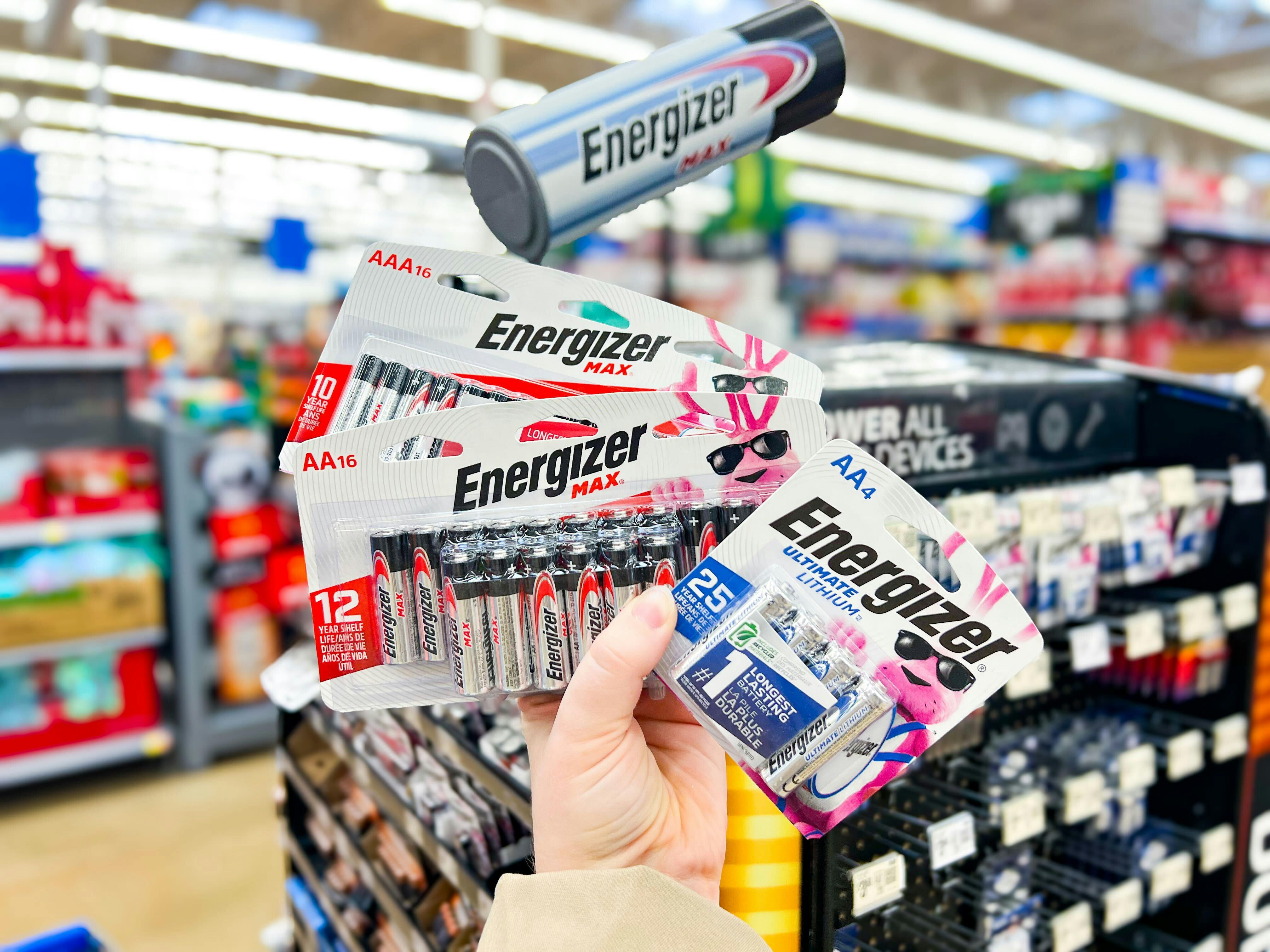 hand holding energizer batteries